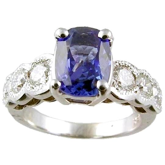Bezel Set Round Diamond with Tanzanite Center Engagement Ring